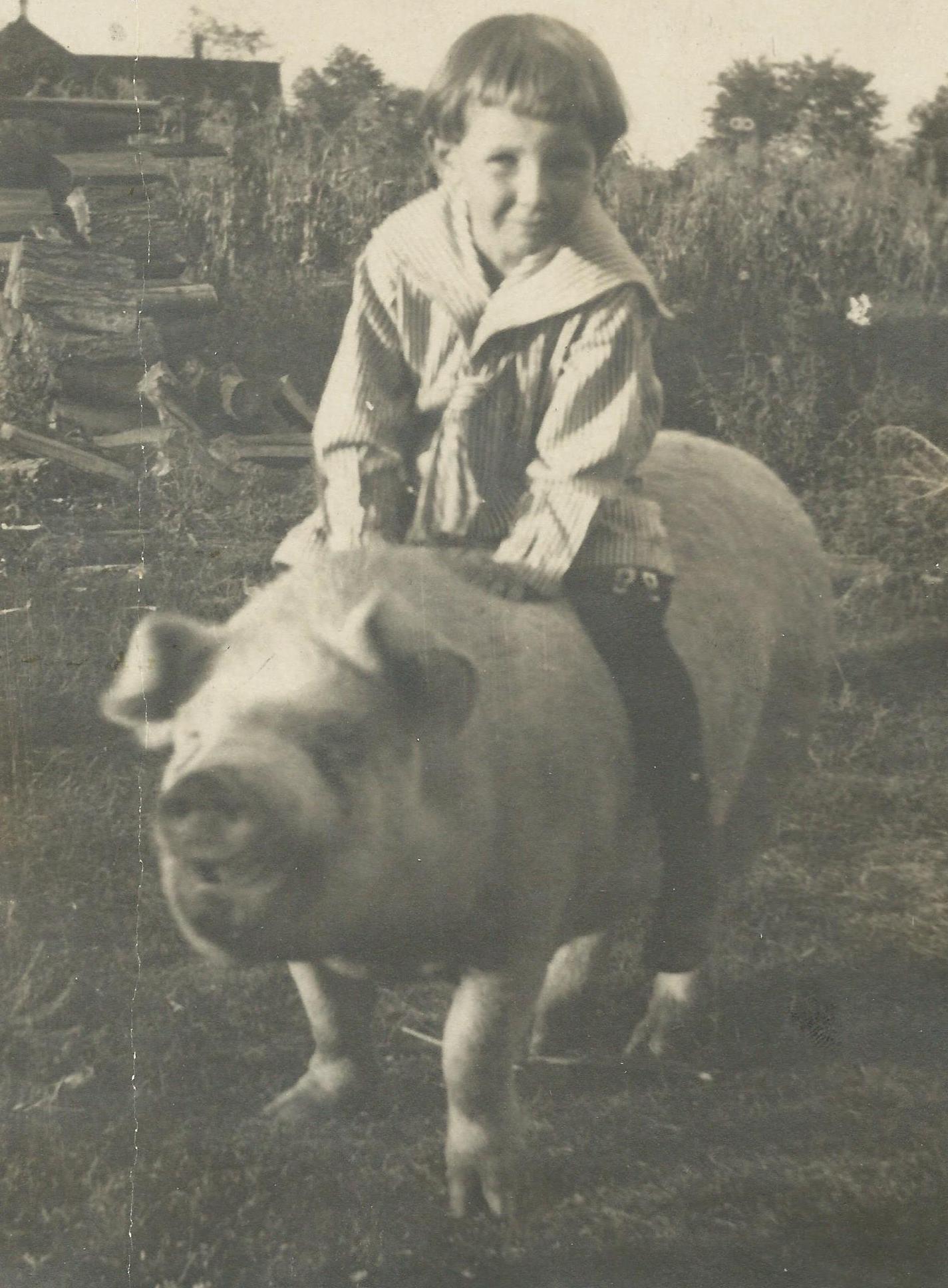 James McNitt riding a pig