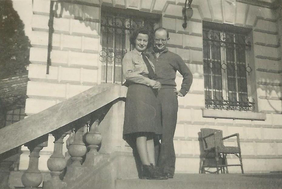 Lilian Harvey and James McNitt on the steps of the building at Versailles in which he worked