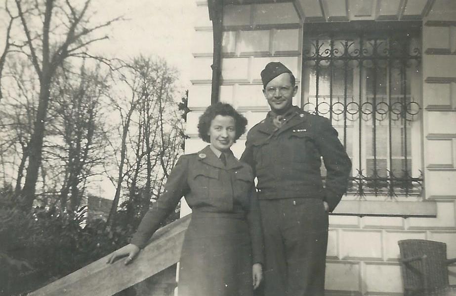 Lilian Harvey and James McNitt on the steps of the building in Versailles in which he worked