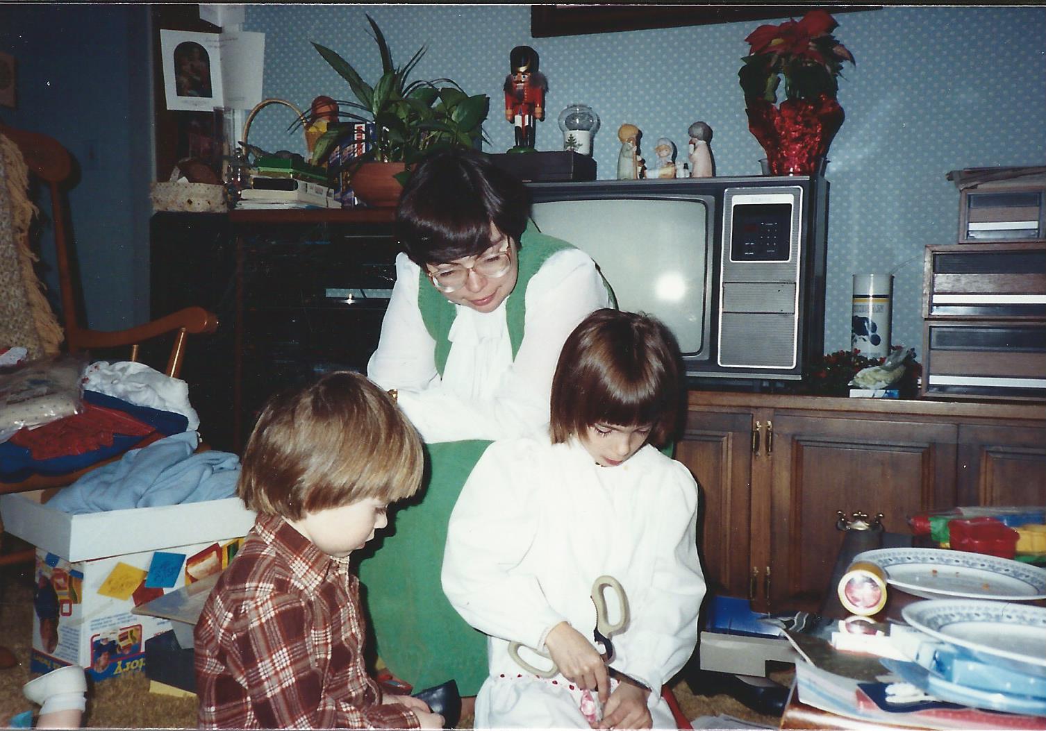 Marilyn, Sarah, and Rebecca at  
              Christmas time in our house, December 25, 1987