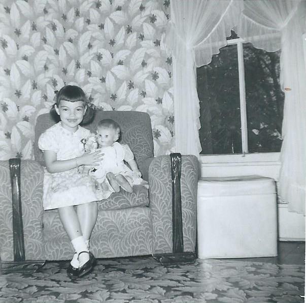 Marilyn Munsell and her doll in a chair