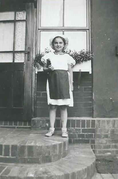 Ruth Weinmann at the door of her aunt Anna Weinmann Wolf's house